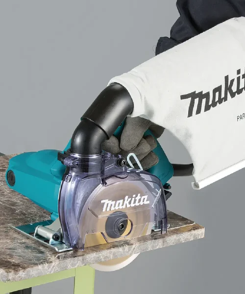Makita dijamantna rezalica 4100KB s plastičnim zaštitnim poklopcem i crnim okretajem.